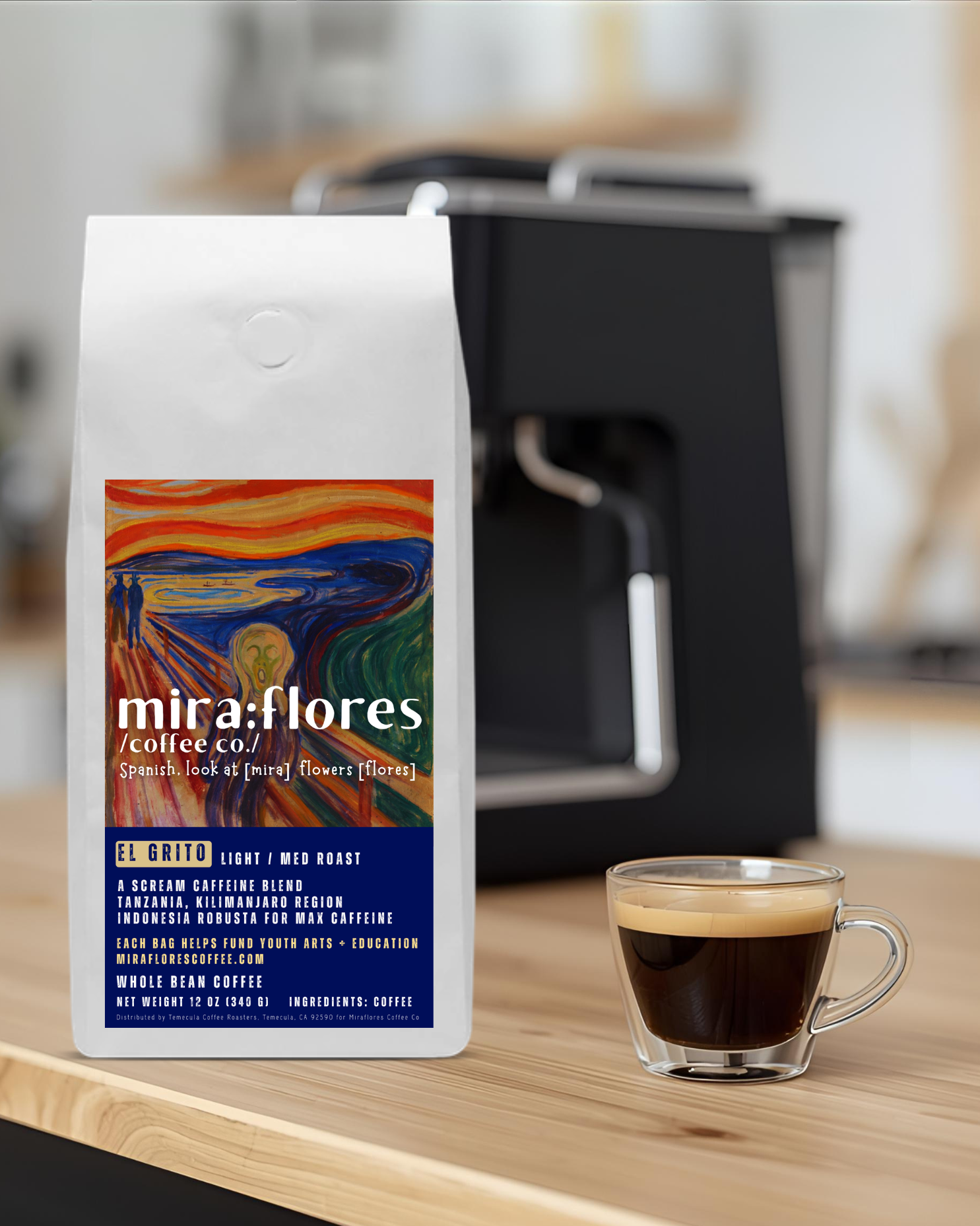 Specialty coffee bag for Max Caffeine light roast with miraflores branding and art masterpiece The Scream by Edward Munch, set on a counter with a shot of espresso and an espresso machine