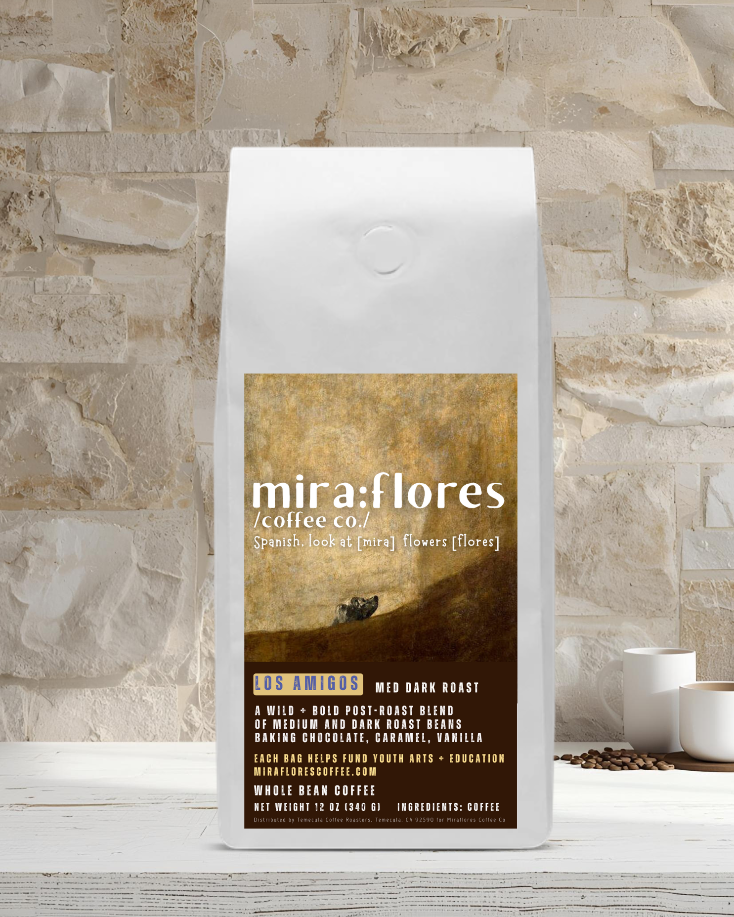 Specialty coffee bag for medium roast and dark roast espresso with miraflores branding and art masterpiece The Dog by Francisco Goya, set against a stone wall background